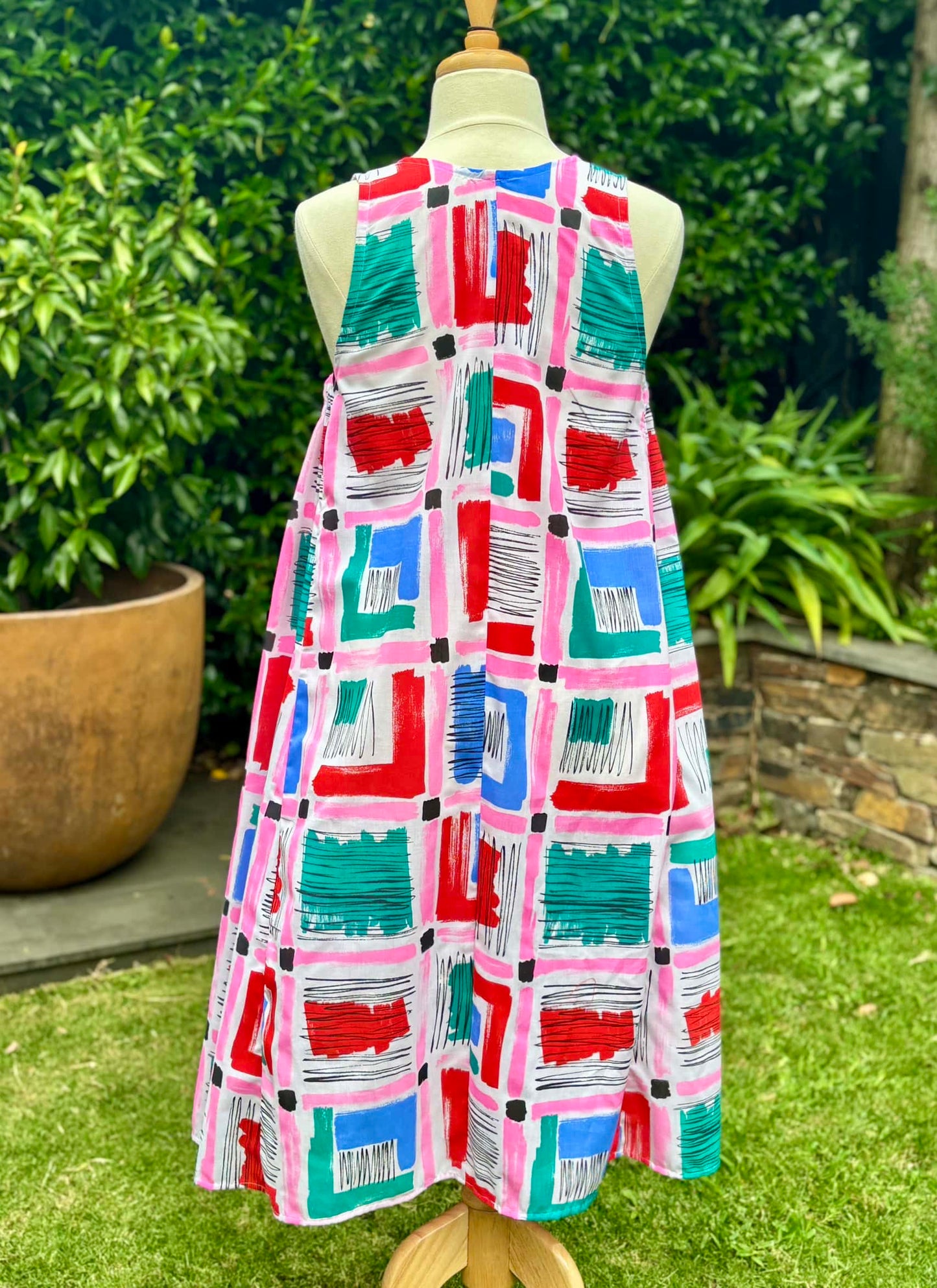 Belinda Pinafore | pink geometric