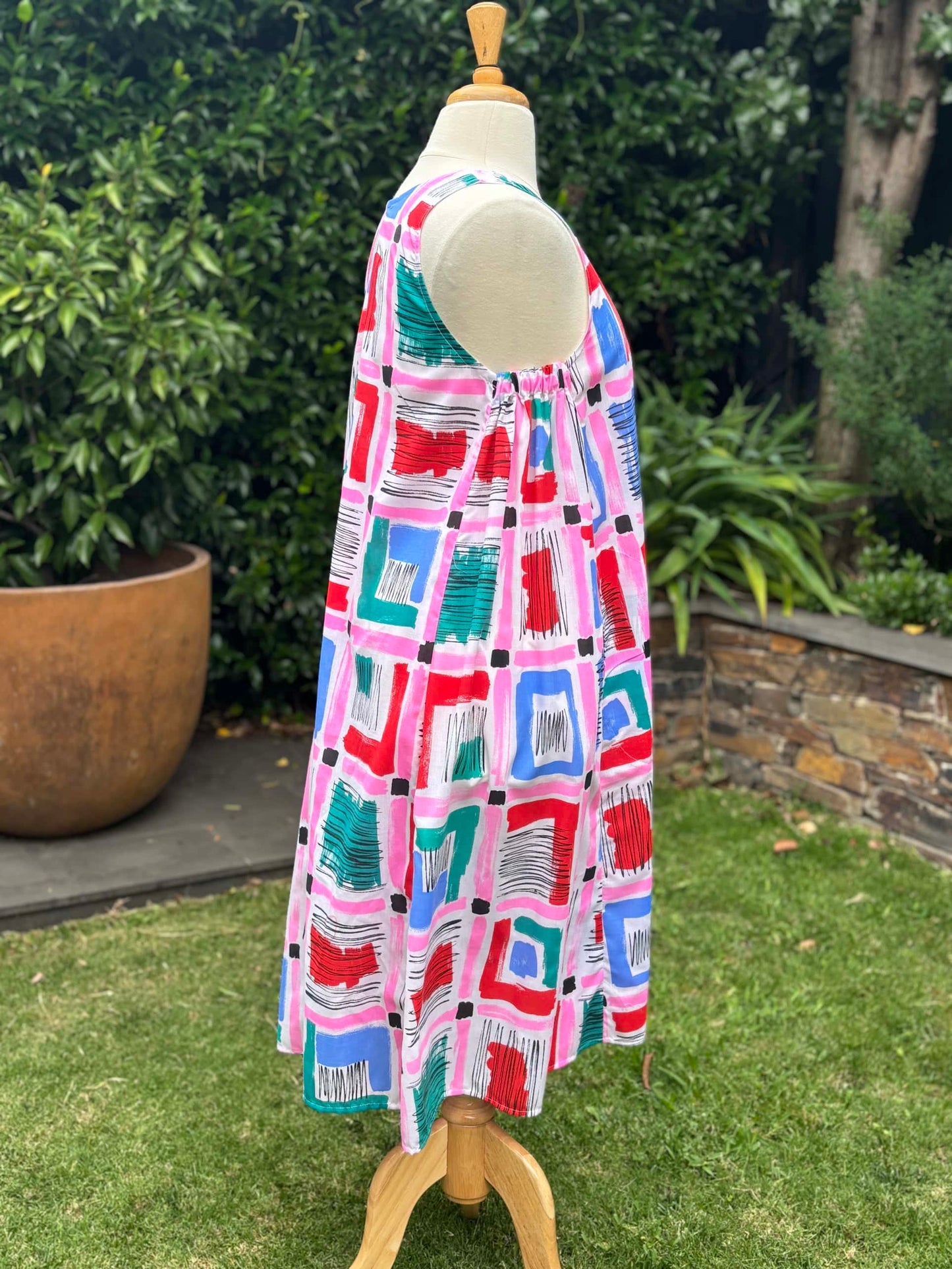 Belinda Pinafore | pink geometric