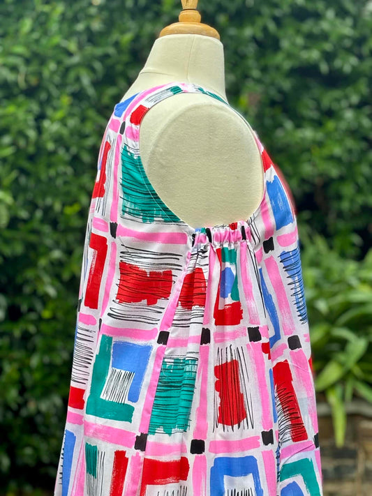 Belinda Pinafore | pink geometric