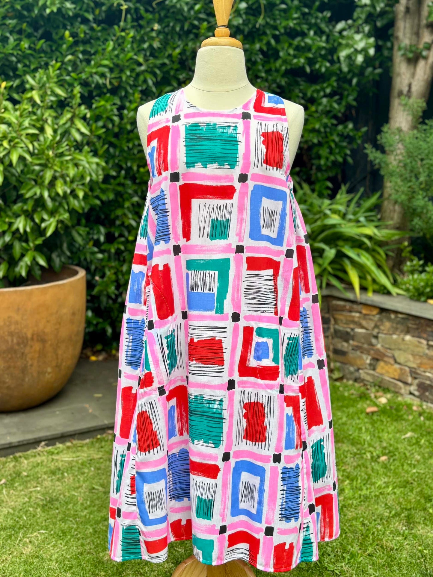 Belinda Pinafore | pink geometric